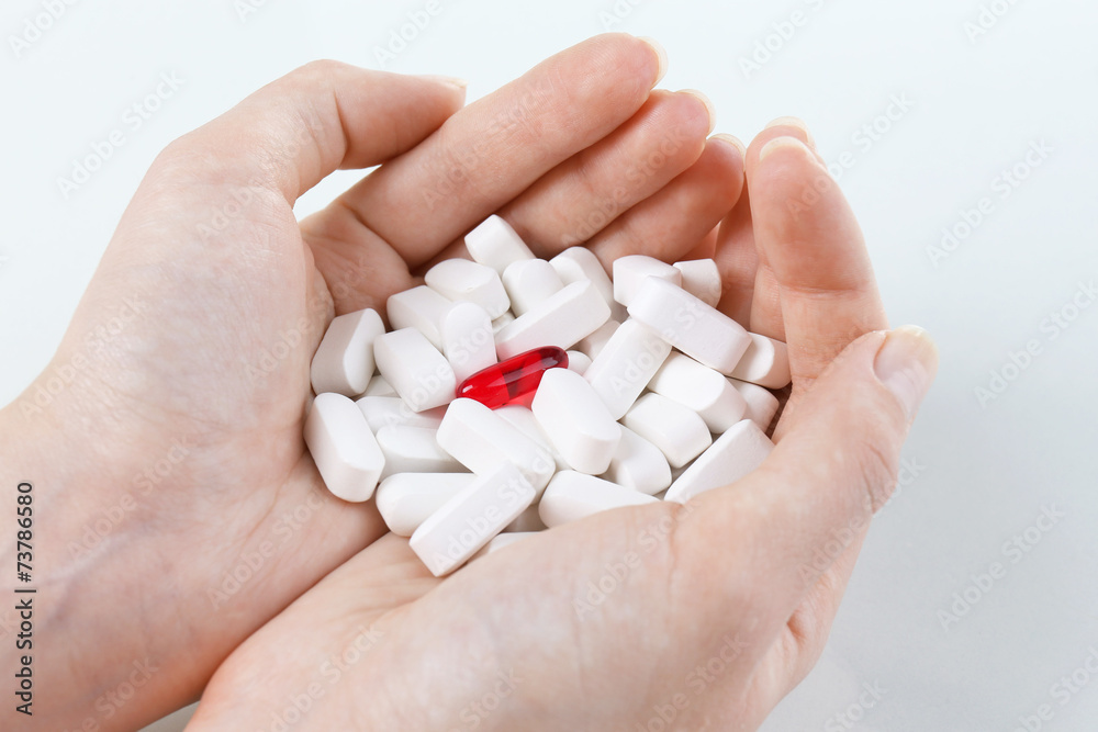 Pills in hand, close-up