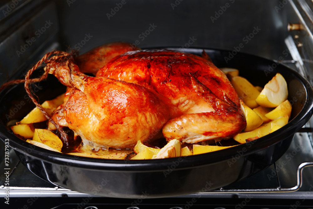 Fototapeta premium Delicious baked chicken in oven close-up