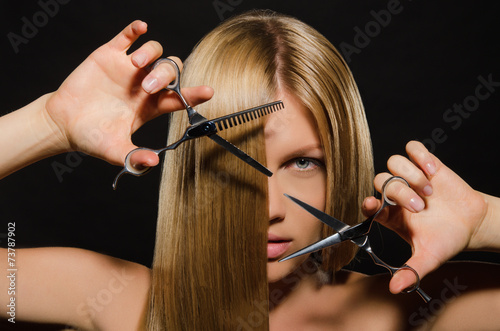woman with straight hair and scissors