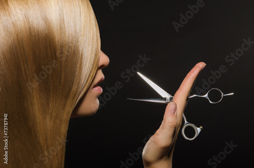 Принти на полотні Beautiful woman with straight hair and scissors
