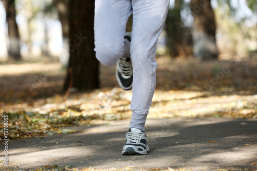 Young man jogging at park