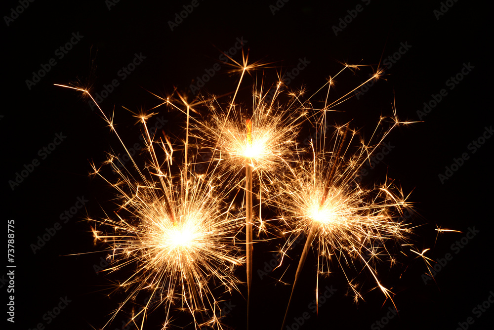Three burning christmas sparklers