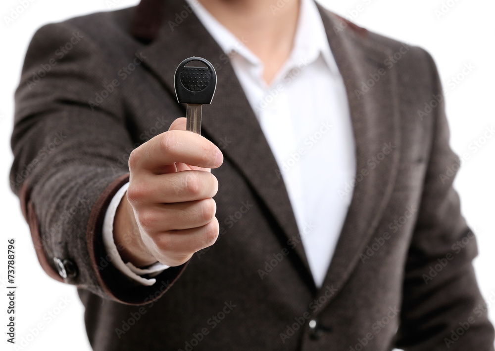 Businessman holding car key isolated on white Businessman holding car key isolated on white