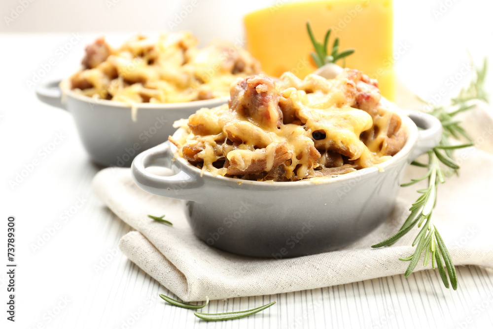 Pasta baked with vegetables and cheese in ceramic pot Pasta baked with vegetables and cheese in ceramic pot