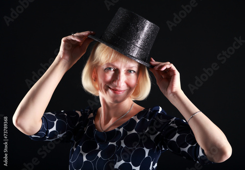 woman trying on a hat