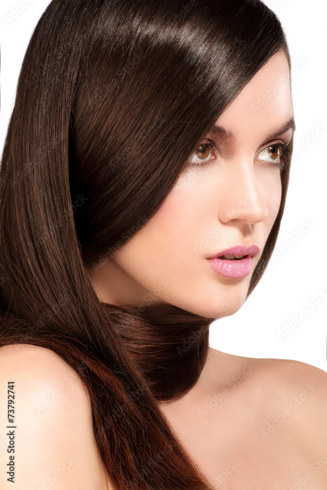 Beauty model showing perfect skin and long healthy brown hair Beauty model showing perfect skin and long healthy brown hair