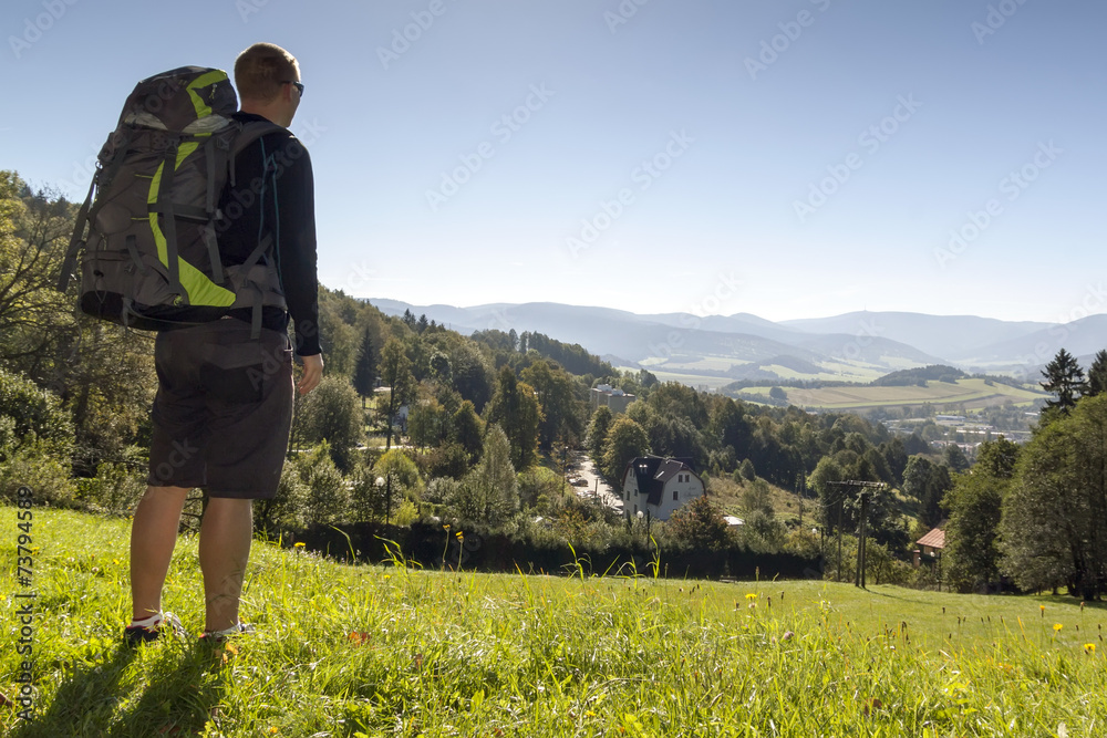 Man looks out over the mountains, Czech mountains Jesenik