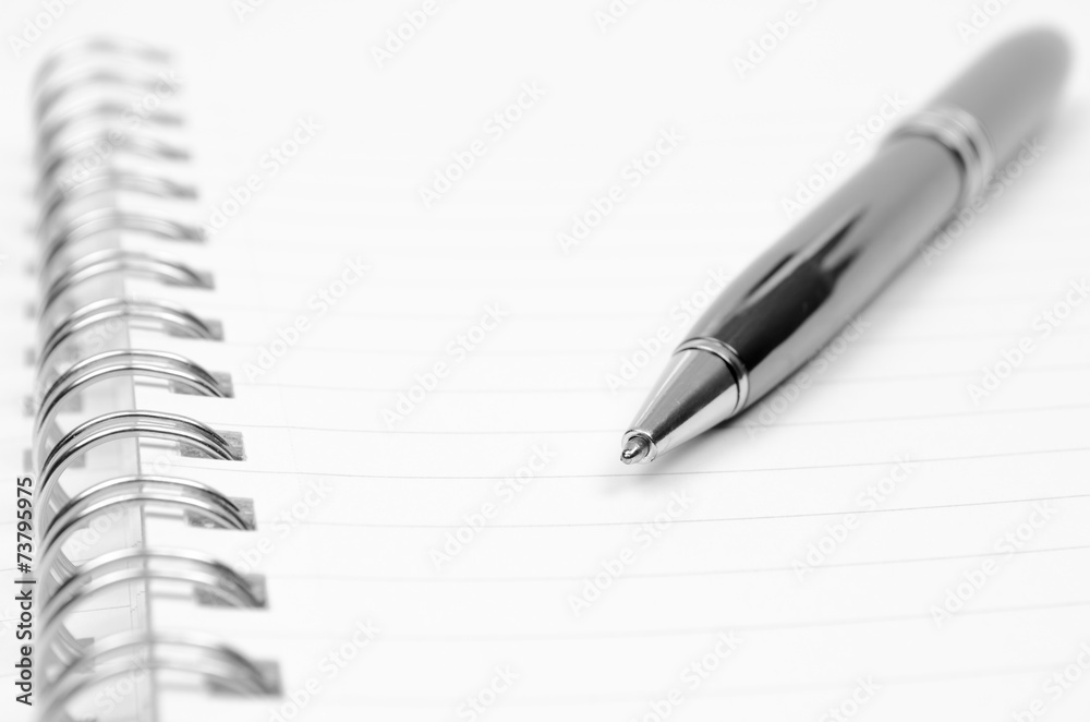Spiral notebook and pen Spiral notebook and pen