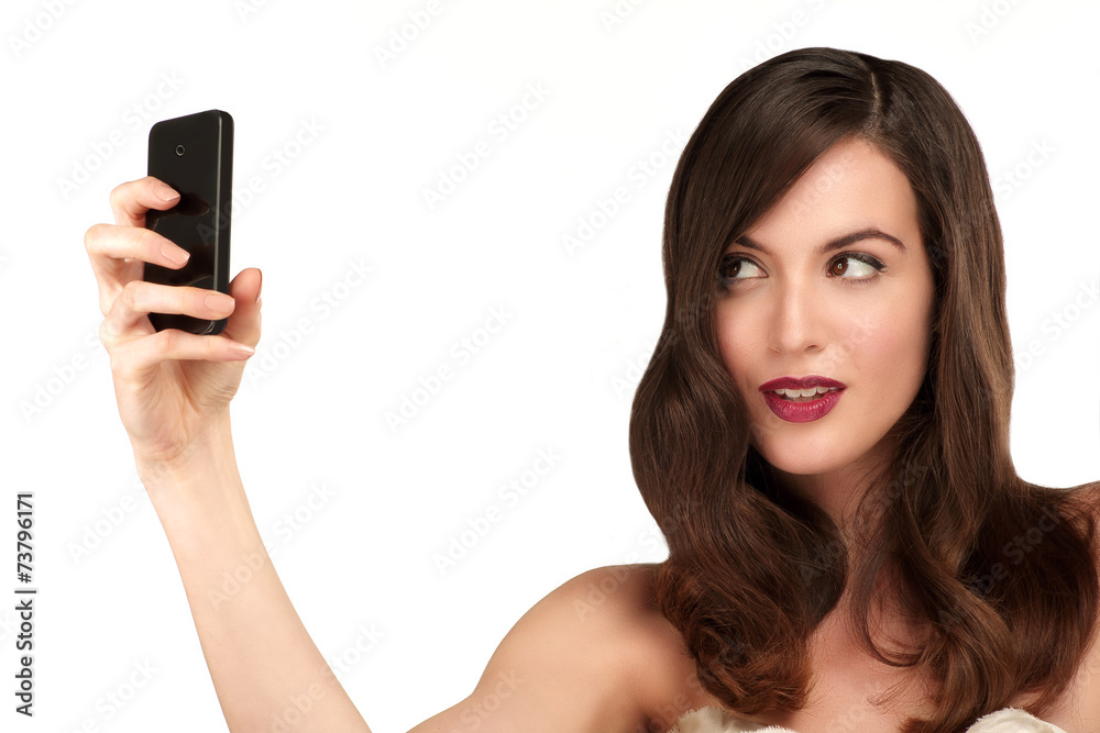 Beautiful woman taking a selfie with smartphone Beautiful woman taking a selfie with smartphone