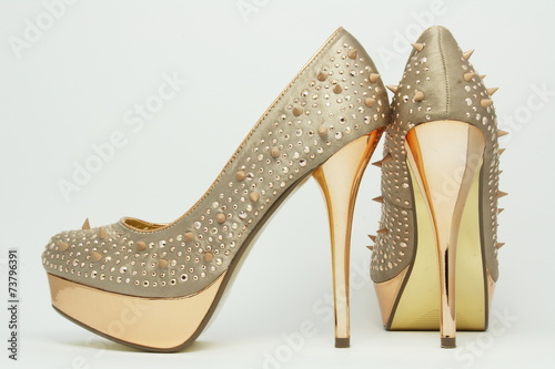 Gold shoes with spikes on 14cm heels. photo