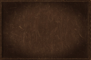 Dark brown grunge background from distress leather texture