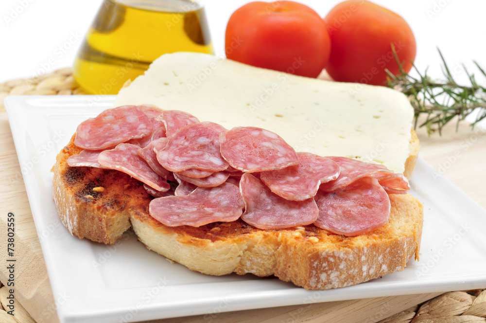 pa amb tomaquet amb fuet, bread with tomato and a typical sausag pa amb tomaquet amb fuet, bread with tomato and a typical sausag