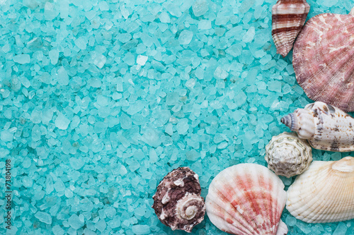 blue bath salt and seashells