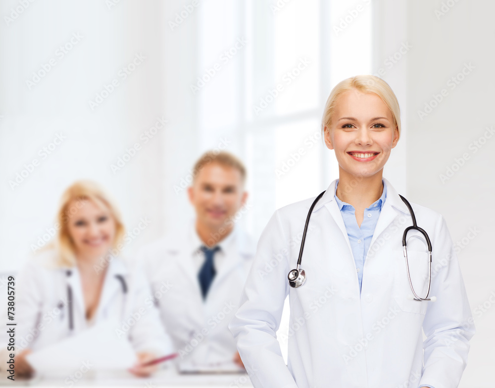 smiling female doctor with stethoscope smiling female doctor with stethoscope