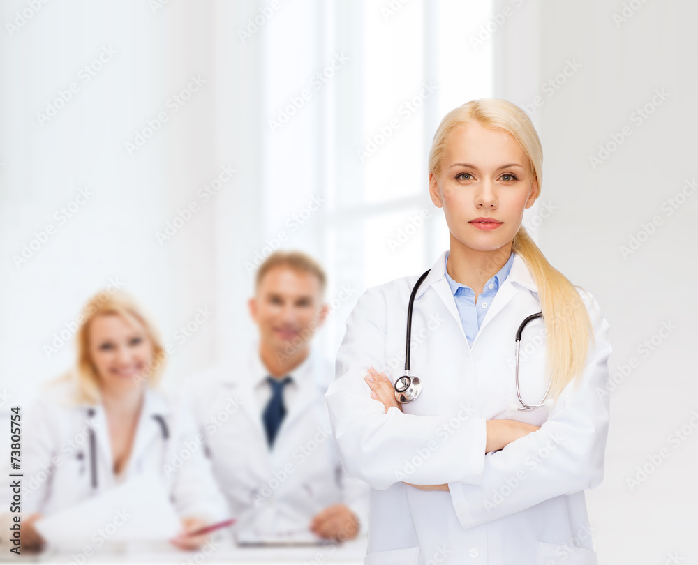 Fototapeta premium serious female doctor with stethoscope