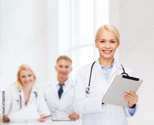 female doctor with stethoscope and tablet pc