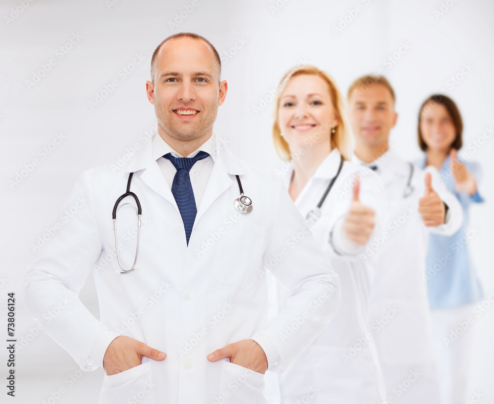 smiling male doctor with stethoscope smiling male doctor with stethoscope