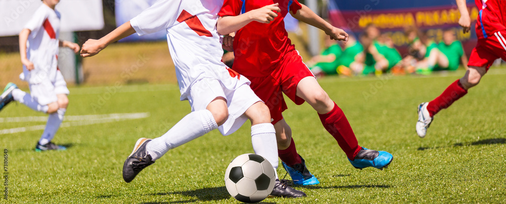 Football match for children. Boys playing football tournament Football match for children. Boys playing football tournament
