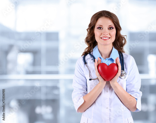 Young beautiful doctor hold...