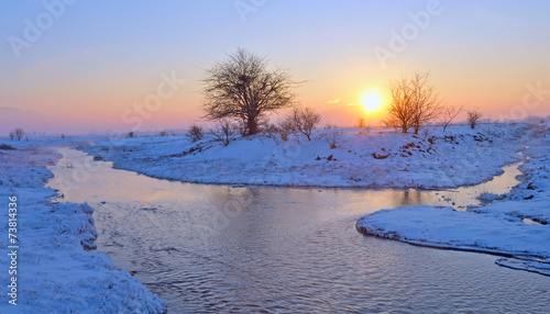 sunset over winter river