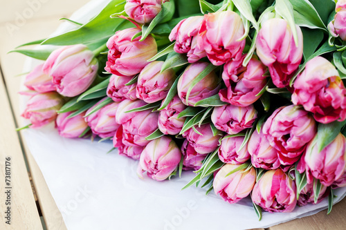 Fototapeta Naklejka Na Ścianę i Meble -  Bunch of beautiful pink tulips on wooden table