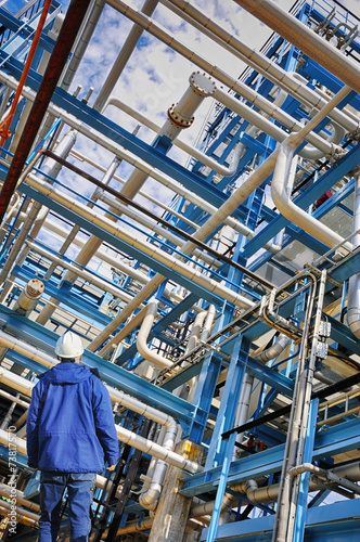 oil worker and large pipeline construction, powerful color.