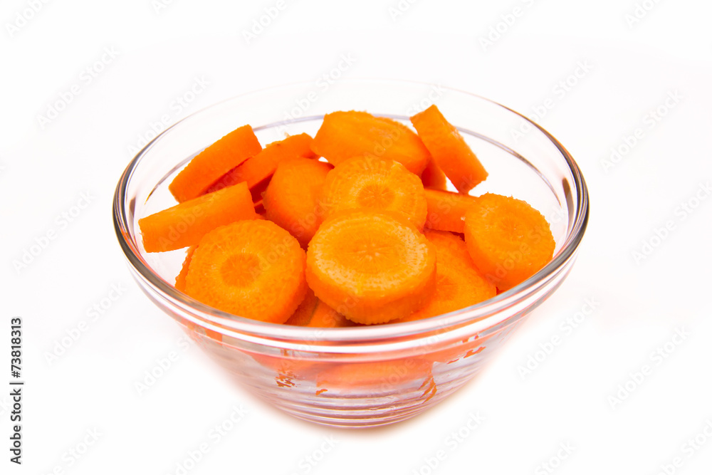 Carrot slices on bowl on white background Carrot slices on bowl on white background