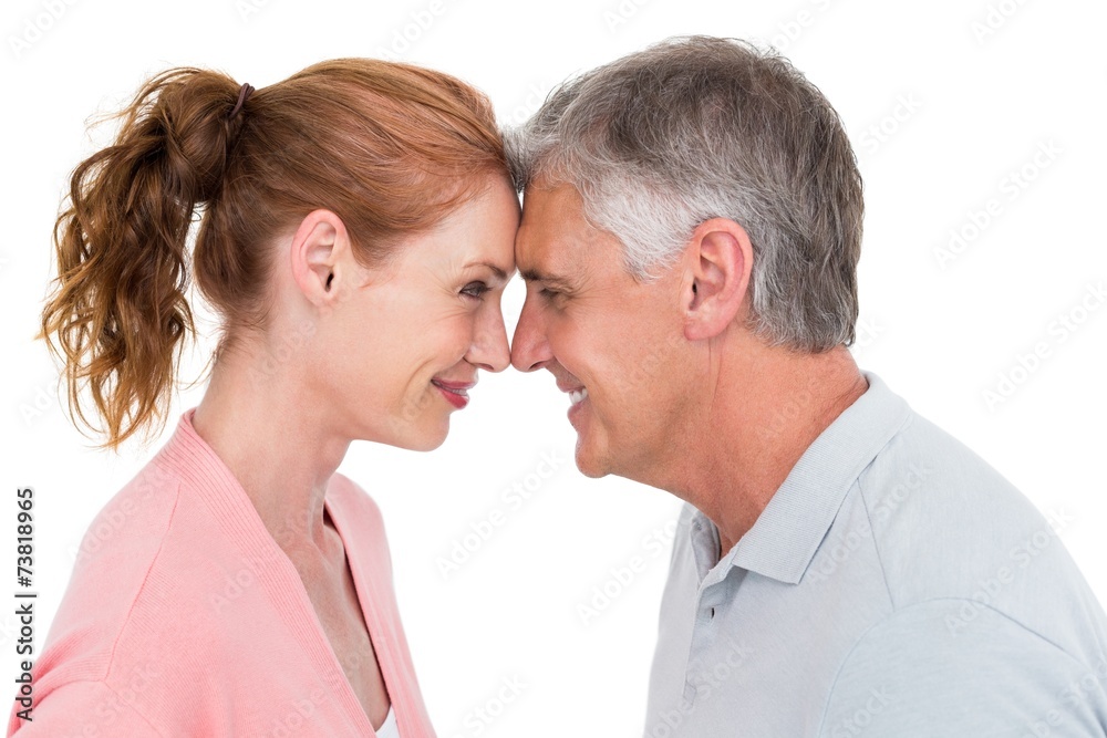 Casual couple smiling at each other Casual couple smiling at each other