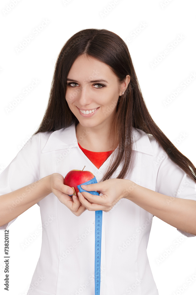 Nutritionist Doctor Measuring an Apple Fruit Nutritionist Doctor Measuring an Apple Fruit