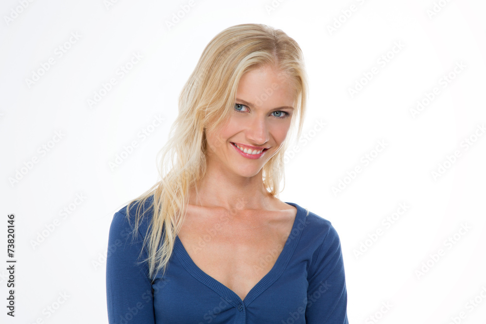 radiant nordic girl in dark blue shirt smiling with head bent at radiant nordic girl in dark blue shirt smiling with head bent at