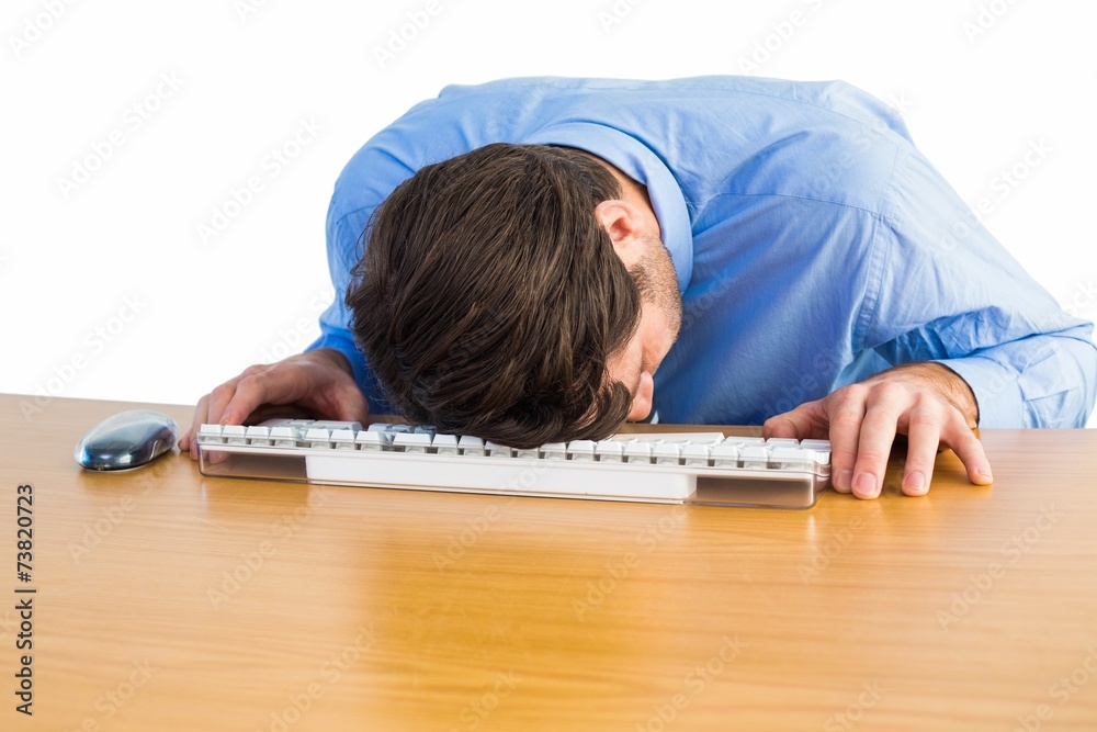 Naklejka premium Businessman sleeping on his keyboard