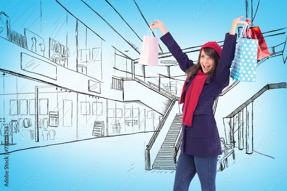 Brunette in winter clothes holding shopping bags Brunette in winter clothes holding shopping bags