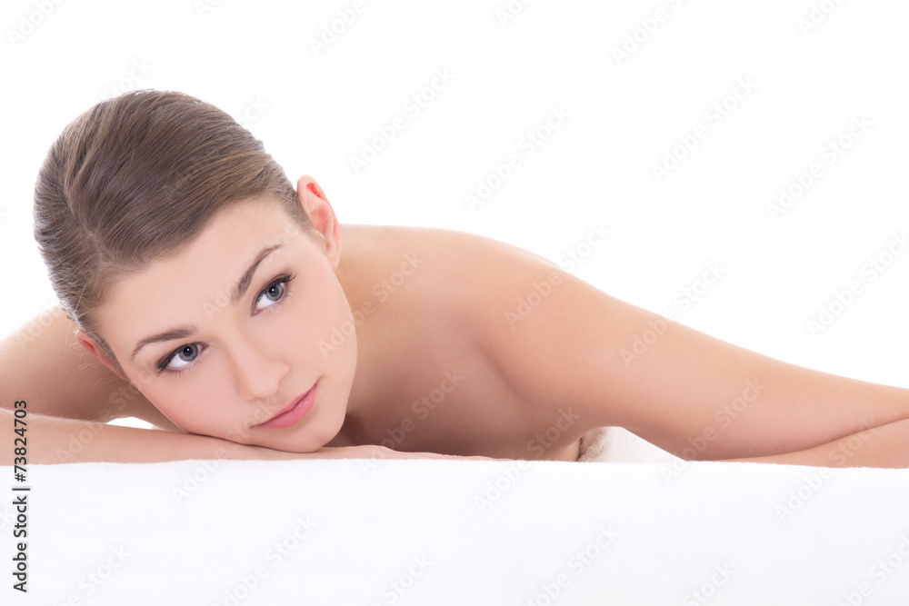 massage concept - young beautiful woman lying on towel isolated massage concept - young beautiful woman lying on towel isolated