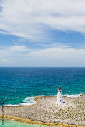 Small White Lighthouse on Sandy Peninsula