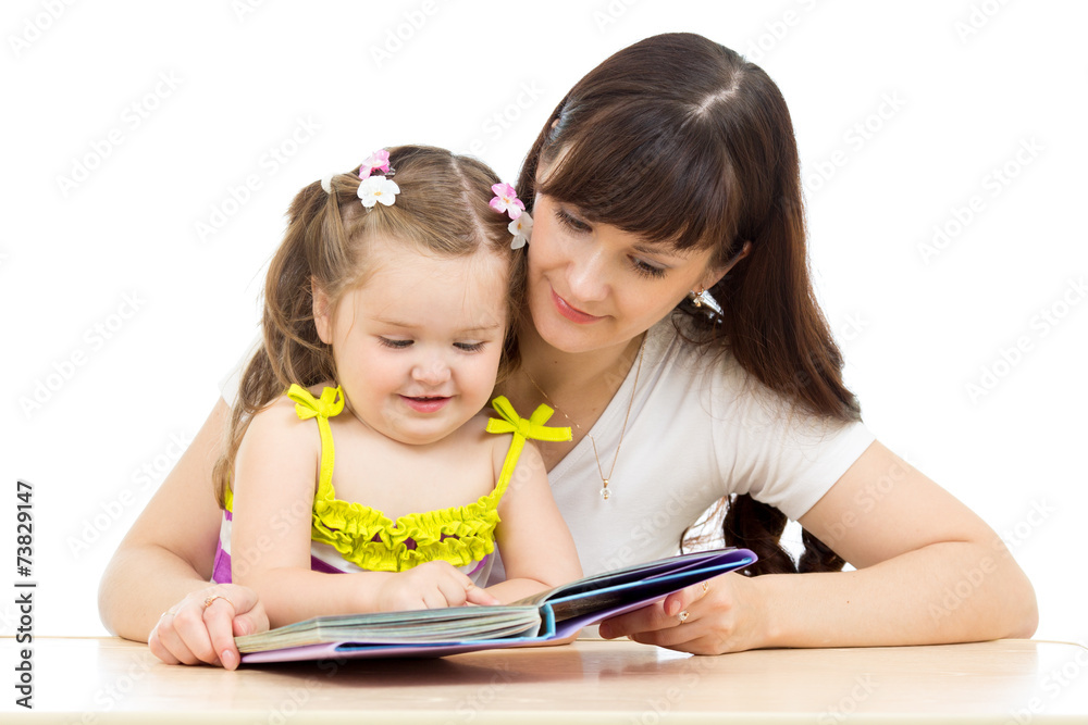 happy mother and kid read a book together happy mother and kid read a book together