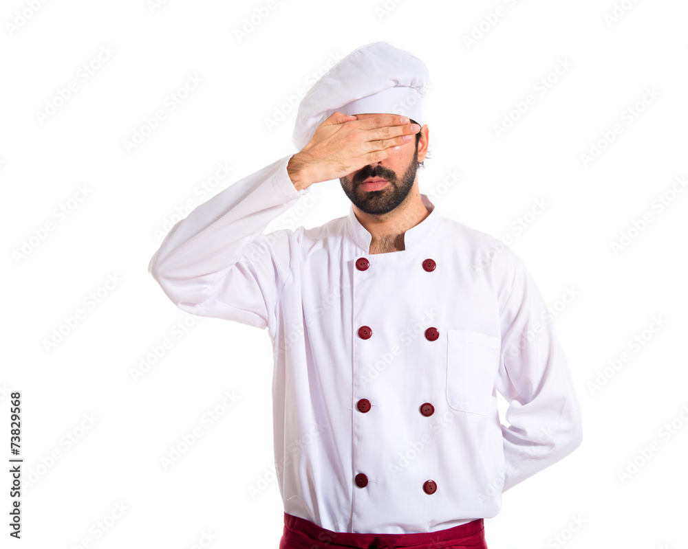 Chef covering his eyes over white background Chef covering his eyes over white background