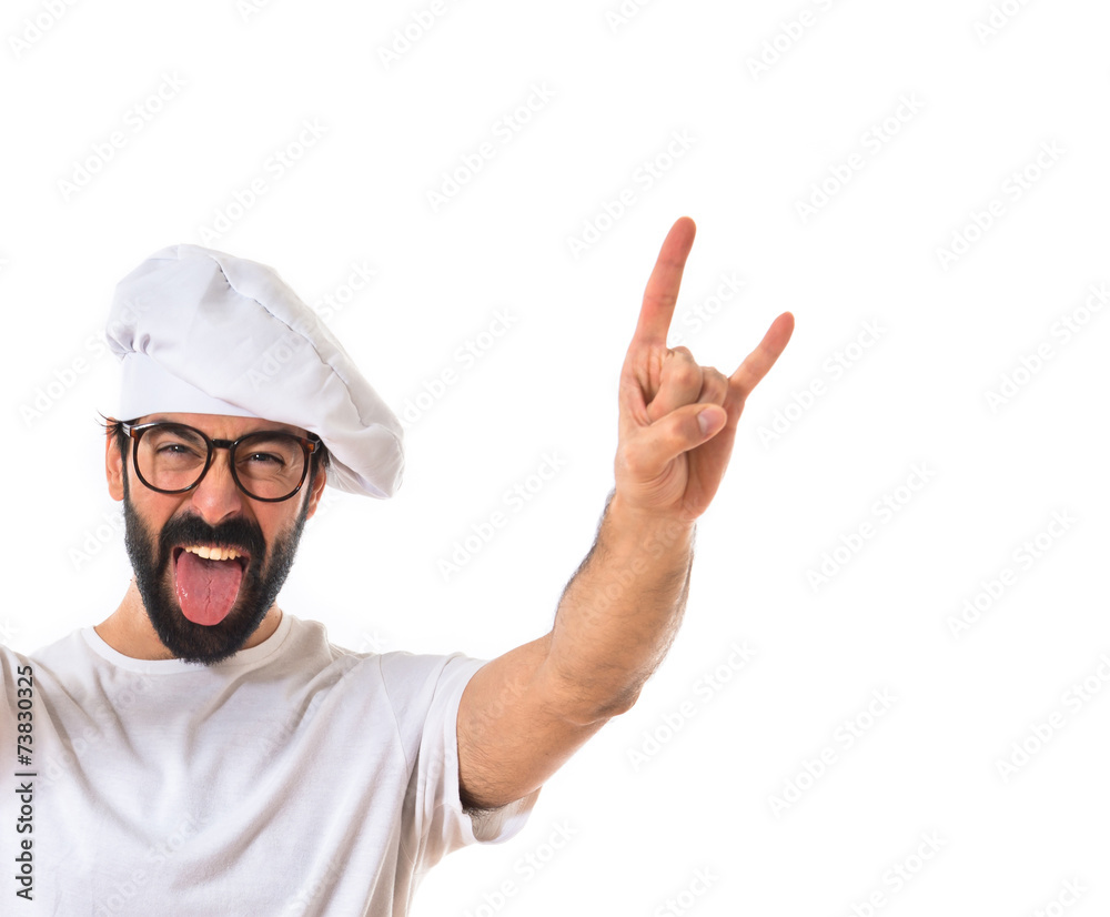Chef making horn gesture over white background Chef making horn gesture over white background