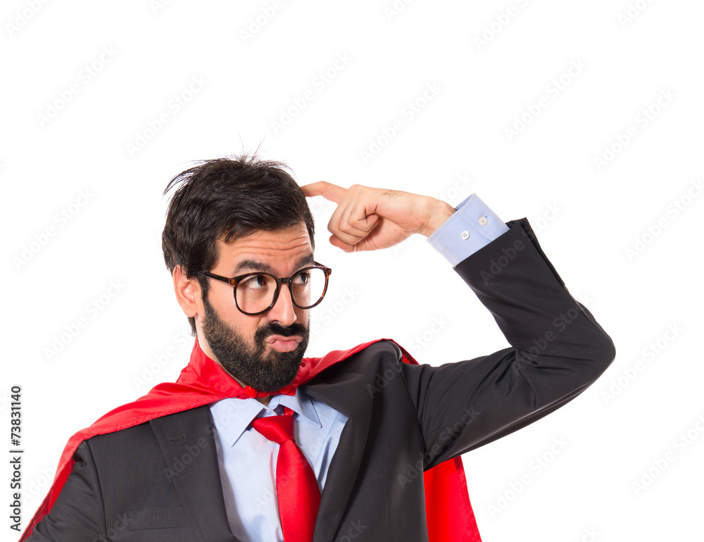 Businessman dressed like superhero thinking over white Businessman dressed like superhero thinking over white
