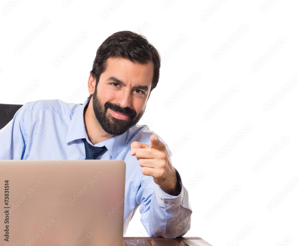 Businessman pointing to the front over white background Businessman pointing to the front over white background