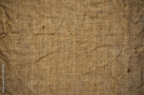 Creased, dirty and full of holes burlap