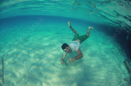 Guy swimming in the ocean