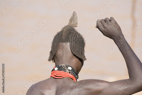 Typical hairstyle of men of the ethnic Hamer group, Ethiopia photo