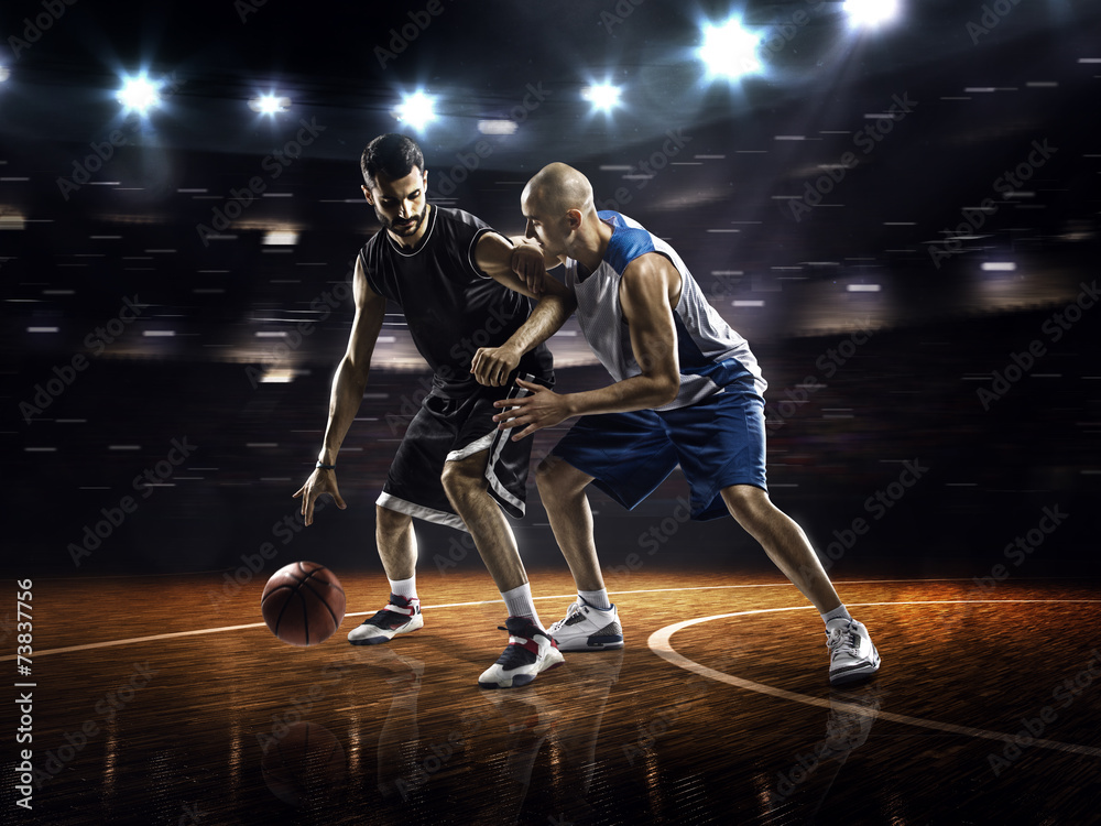 Two basketball players in action Two basketball players in action