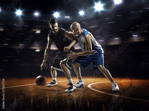 Two basketball players in action © 103tnn