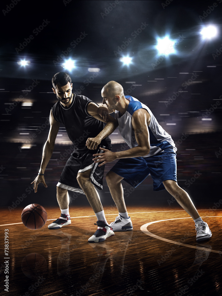Two basketball players in action Two basketball players in action