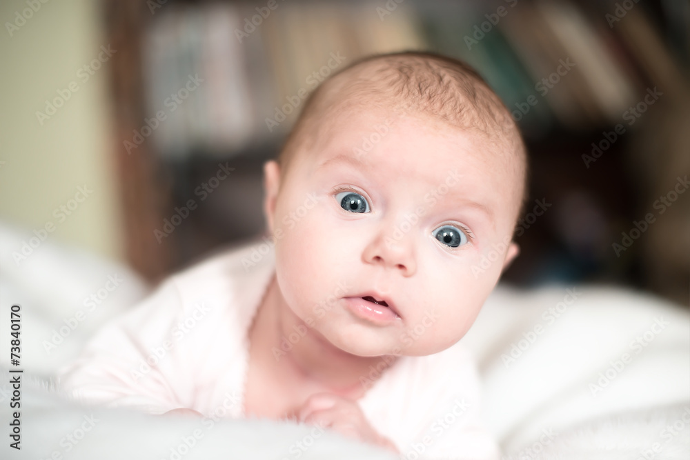 Surprised baby isolated on white