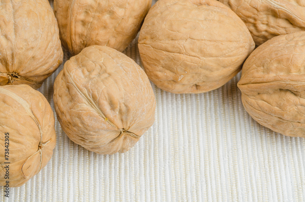 walnut on table cloth, close up walnut on table cloth, close up