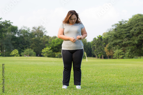 obese women is worrying about her overweight