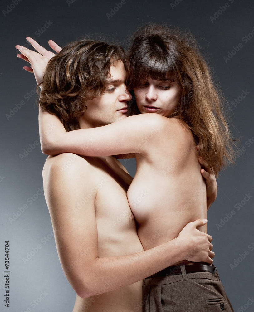 Naklejka premium Young Romantic Couple Embracing
