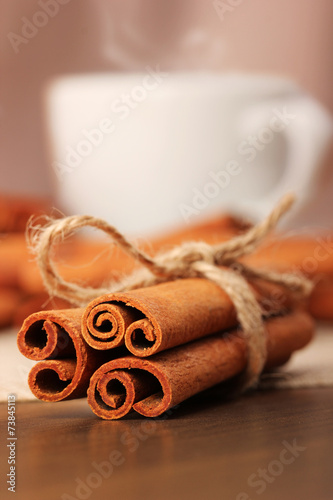 Cinnamon and beverage cup on wooden table series - 5